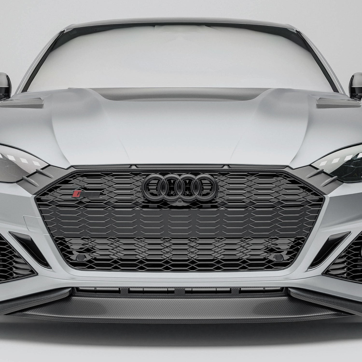 Audi car with a carbon fiber grille on a white background