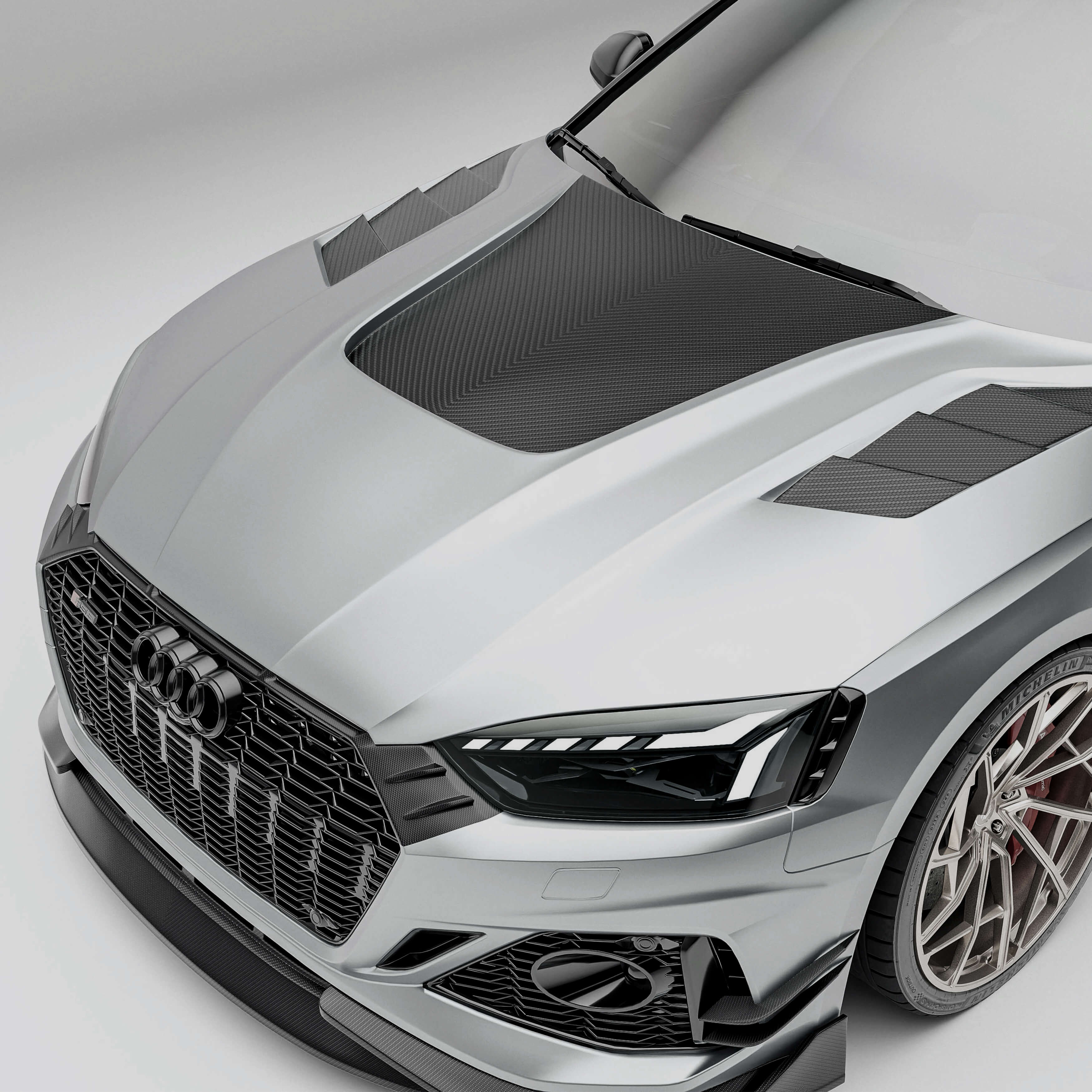 Audi car with a carbon fiber hood on a white background