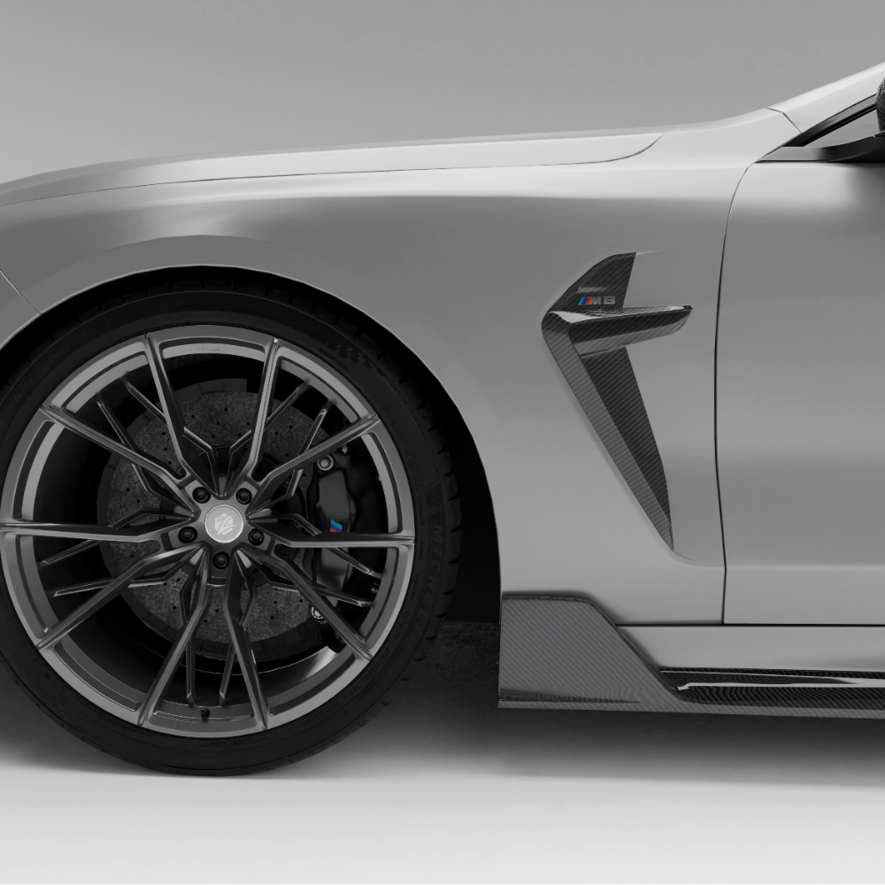 BMW car with a carbon fiber side fender vents a white background
