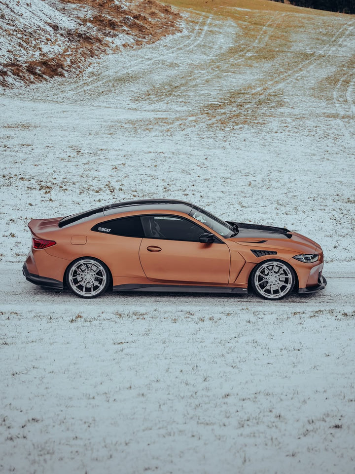 BMW M4 side view in snow