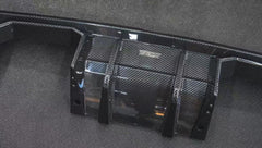 REVOZPORT glossy carbon fiber body kit components displayed before installation, including front lip sections, side skirts, rear diffuser, and aero trim pieces.