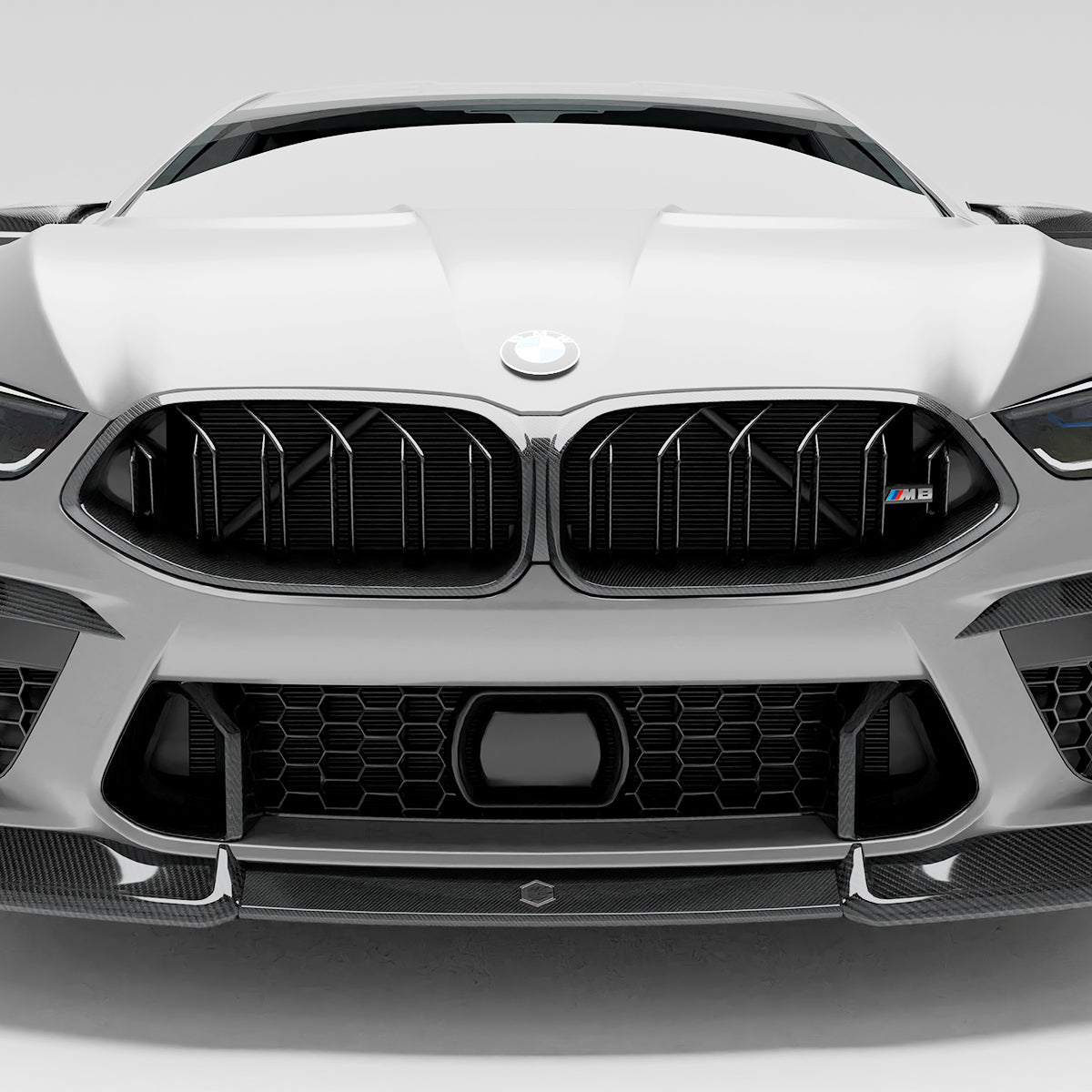 bmw-m8-f92--with-a-carbon-fiber-griile-close-up--on-a-white-background