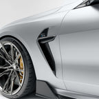 bmw-m8-f92--with-a-carbon-fiber-vent-close-up-on-a-white-background