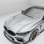 bmw-m8-f92--with-a-carbon-fiber-hood-detail-on-a-white-background