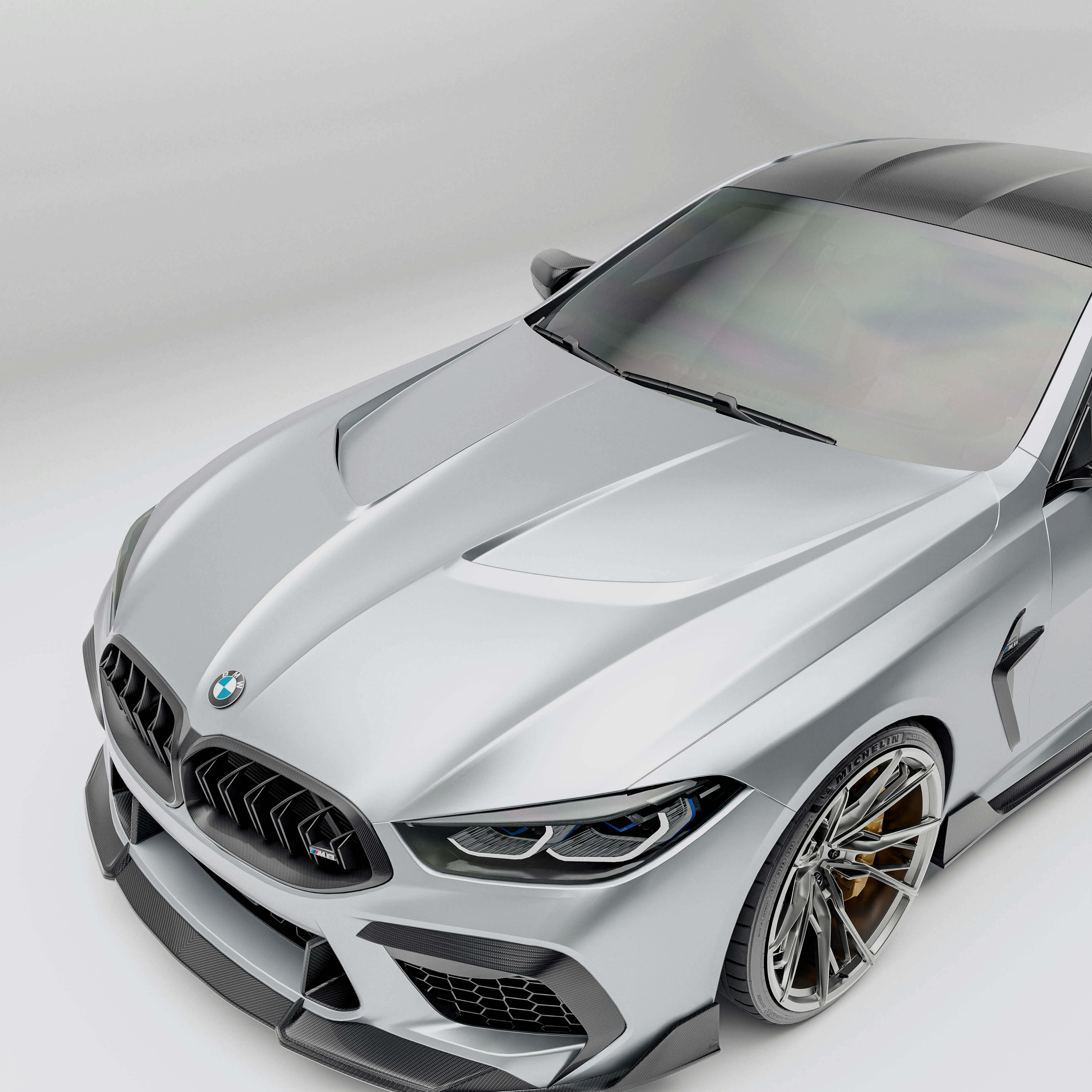 BMW M8 F92  with a carbon fiber hood detail on a white background