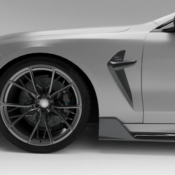 BMW car with a carbon fiber side fender vents a white background