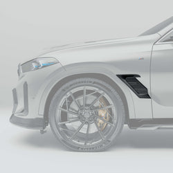 BMW X6 G06: Close-up of the Carbon Fiber Fender Air Intake Against a Gray Background