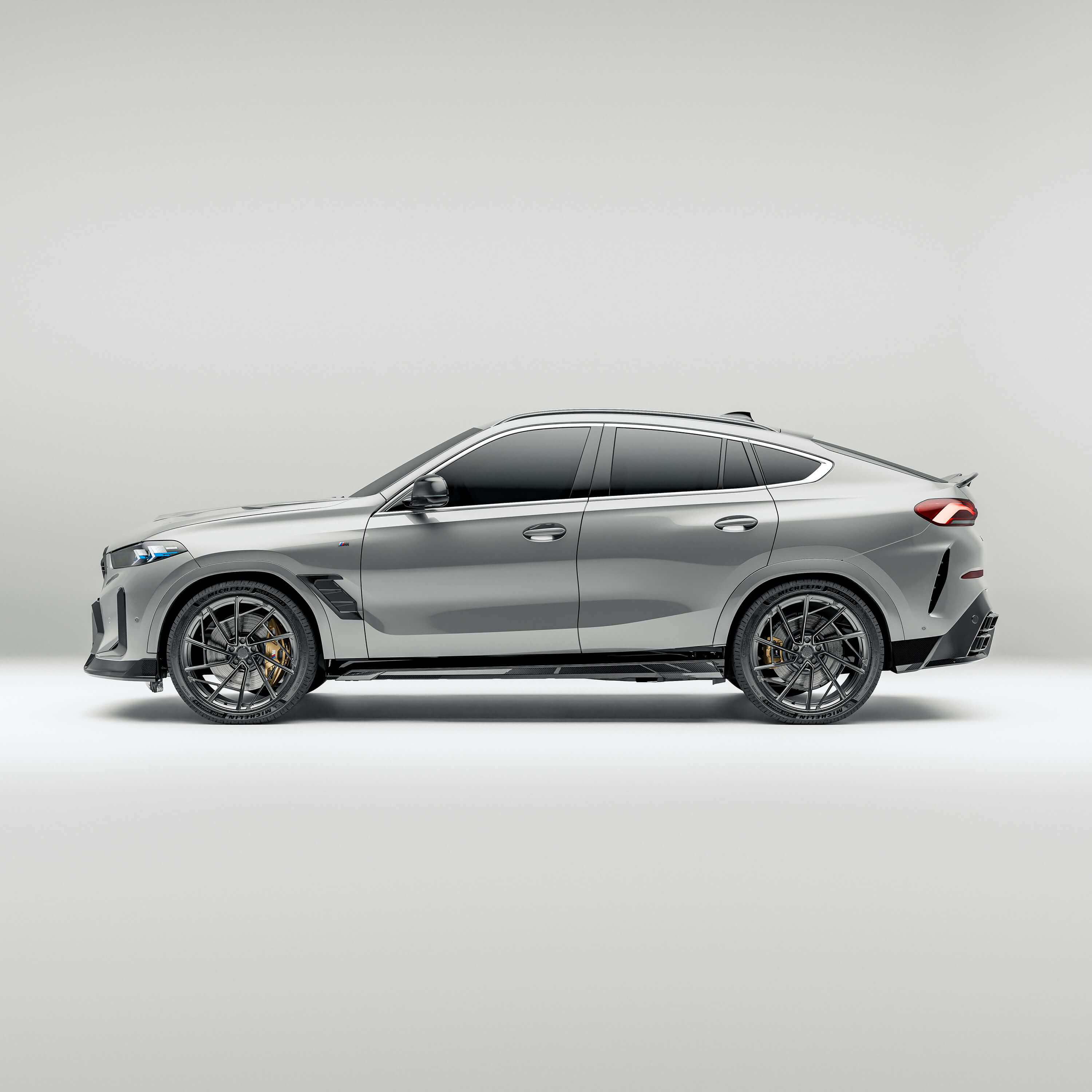 bmw-x6-g06:-side-views-of-the-carbon-fiber-body-kit-against-a-gray-background