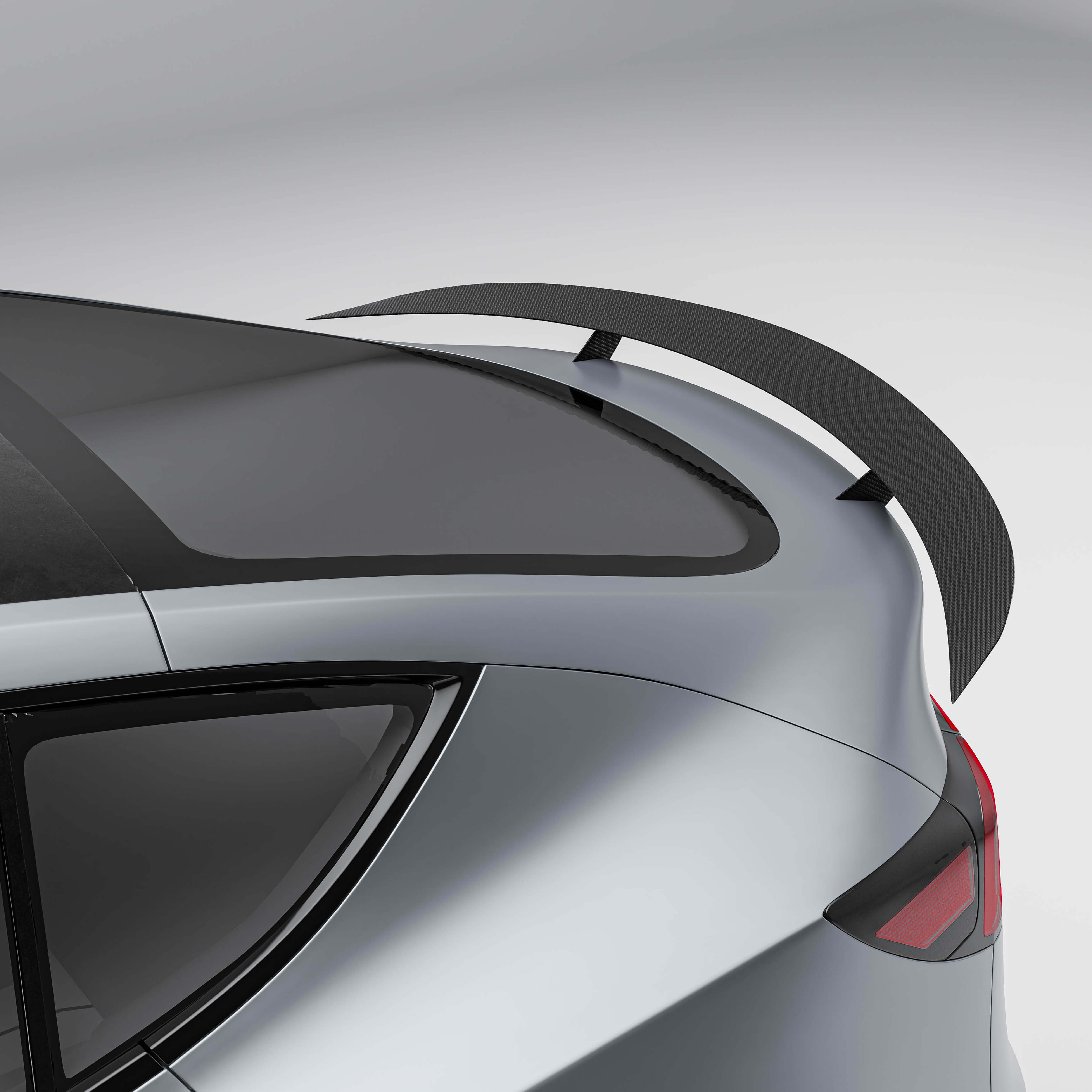 Tesla Model Y 21-24 with a carbon fiber spoiler on a white background