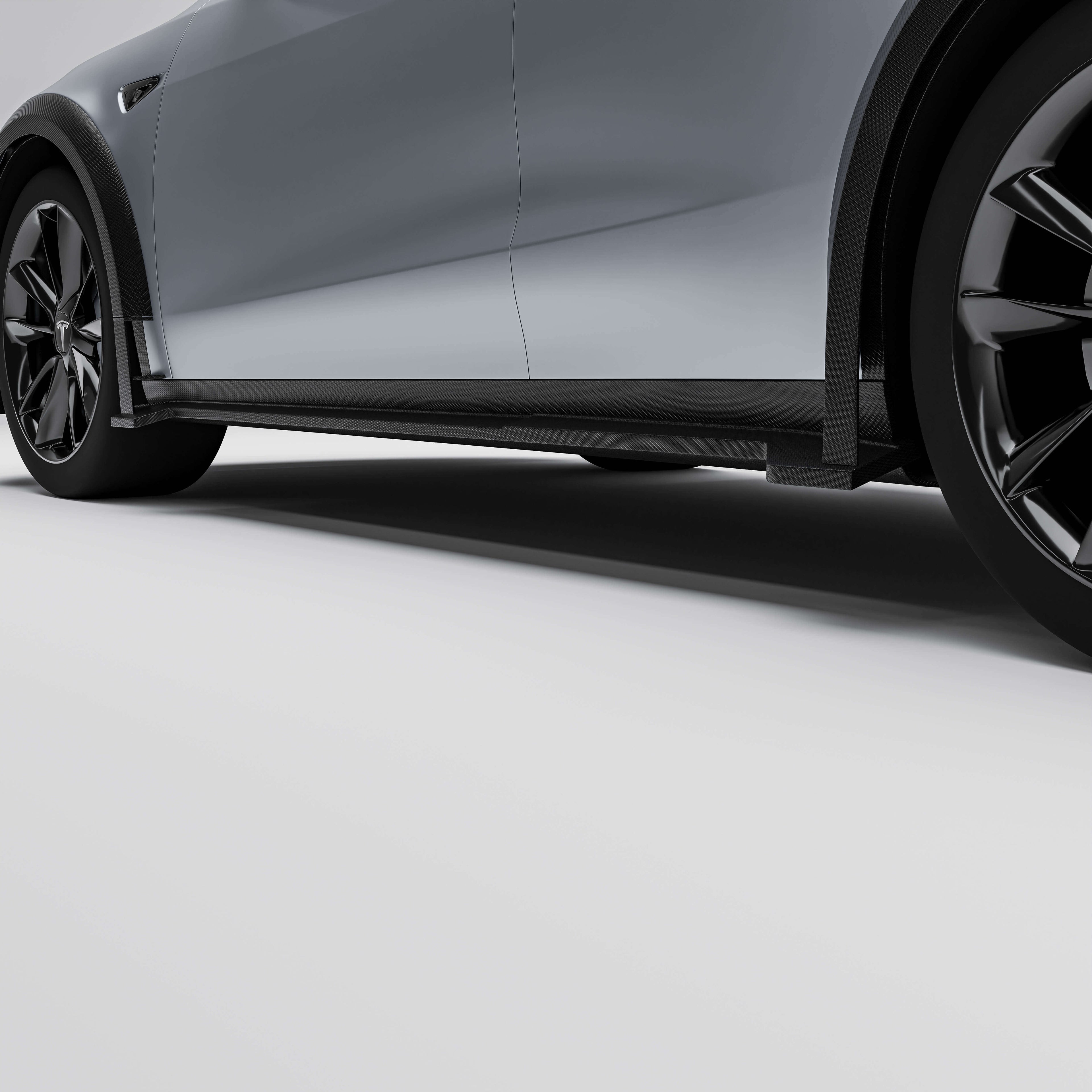 tesla-model-y-21-24-with-a-carbon-fiber-side-skirts-on-a-white-background