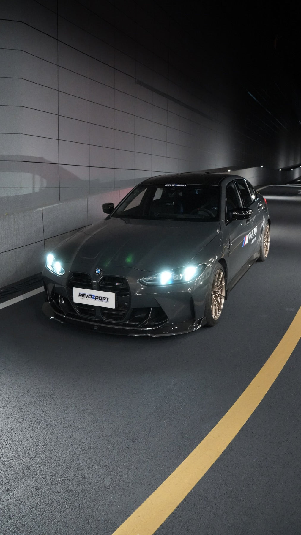BMW M3 G80 Street Program official BMW dealer front three quarter night