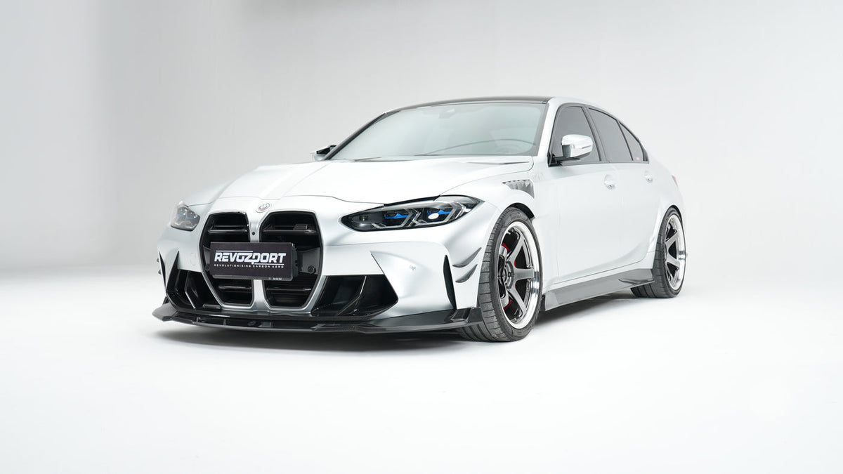 BMW M3 G80 Street Program silver front three quarter with RevoZport front lip front grille without ACC front trim and front vents