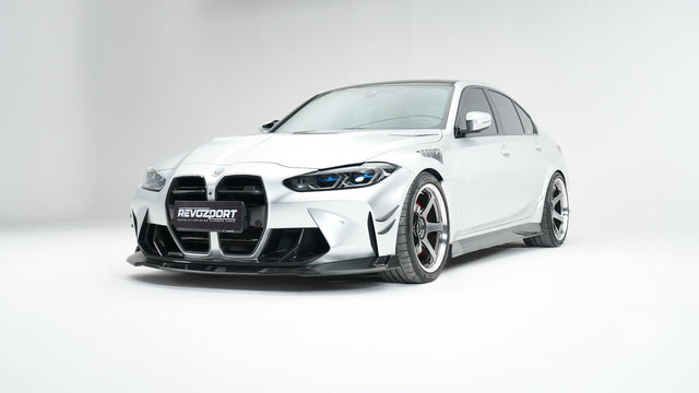 BMW M3 G80 Street Program silver front three quarter with RevoZport front lip front grille without ACC front trim and front vents