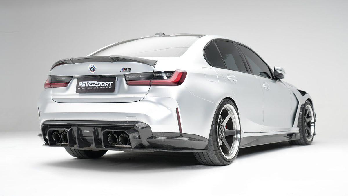 BMW M3 G80 Street Program silver rear three quarter with RevoZport rear diffuser side skirts and trunk spoiler