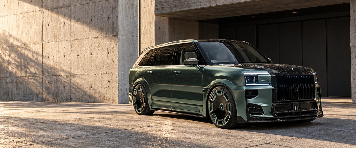 Green VELOIRE ZEEKR 9X with carbon exterior against warm concrete architecture